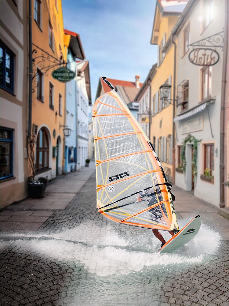 Person Windsurfing Down Narrow European Street